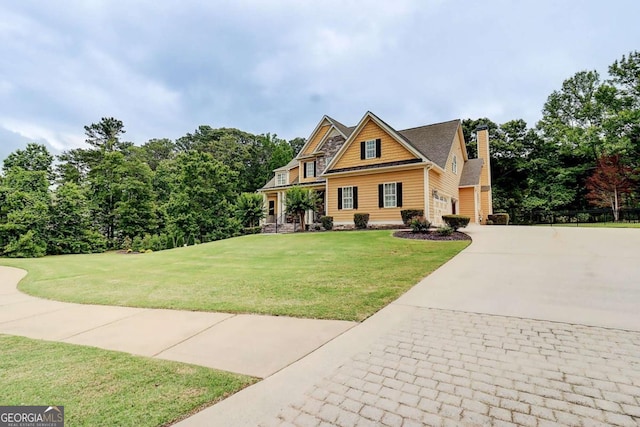 116 Archstone Sq, Mcdonough, GA 30253 - view of front of home with driveway, a front lawn, and a chimney