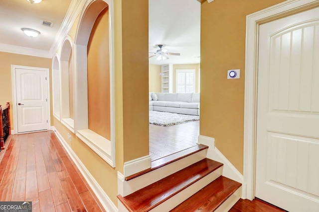 116 Archstone Sq, Mcdonough, GA 30253 - hallway with hardwood / wood-style flooring, arched walkways, and crown molding