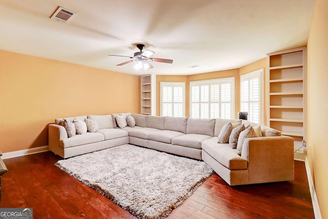 116 Archstone Sq, Mcdonough, GA 30253 - living area featuring dark wood-style flooring and a ceiling fan