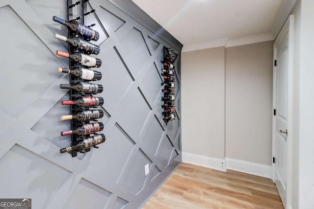 116 Archstone Sq, Mcdonough, GA 30253 - wine room featuring light wood-type flooring and baseboards