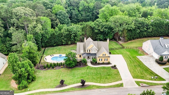 116 Archstone Sq, Mcdonough, GA 30253 - aerial view of property and surrounding area featuring a pool and a forest