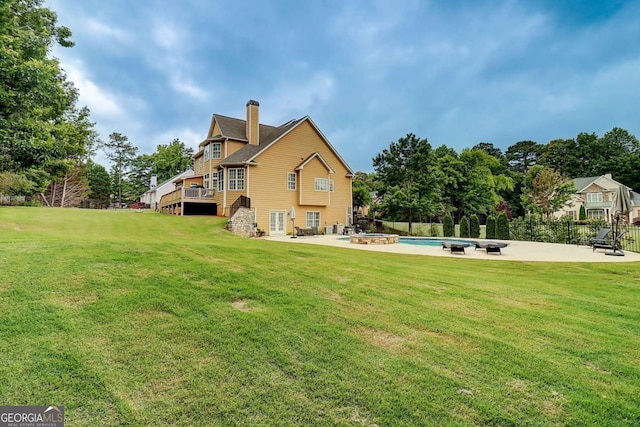 116 Archstone Sq, Mcdonough, GA 30253 - rear view of property featuring a chimney, a pool with connected hot tub, and a patio