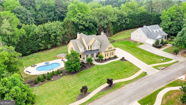116 Archstone Sq, Mcdonough, GA 30253 - view of subject property with a pool area and a heavily wooded area