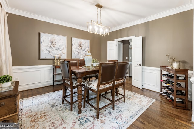10530 Tuxford Dr, Alpharetta, GA 30022 - dining space with crown molding, a chandelier, dark wood-style flooring, and a wainscoted wall
