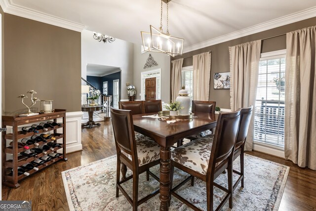 10530 Tuxford Dr, Alpharetta, GA 30022 - dining area featuring a chandelier, ornamental molding, dark wood finished floors, and wainscoting