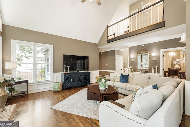 10530 Tuxford Dr, Alpharetta, GA 30022 - living area with high vaulted ceiling, wood finished floors, a decorative wall, wainscoting, and a ceiling fan