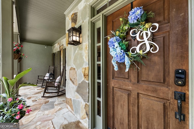10530 Tuxford Dr, Alpharetta, GA 30022 - view of exterior entry featuring covered porch