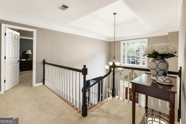 10530 Tuxford Dr, Alpharetta, GA 30022 - hallway featuring an upstairs landing, carpet floors, a tray ceiling, ornamental molding, and a chandelier