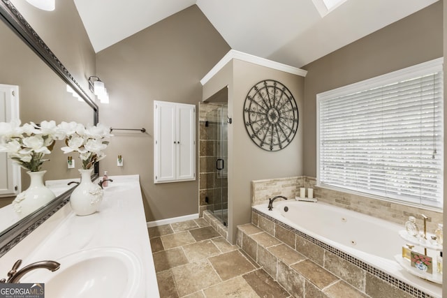 10530 Tuxford Dr, Alpharetta, GA 30022 - bathroom with a jetted tub, a shower stall, stone tile flooring, double vanity, and vaulted ceiling