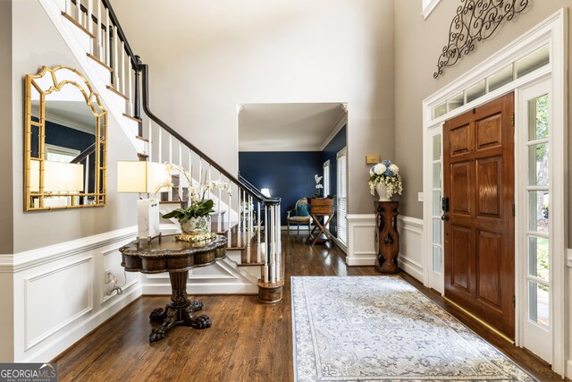 10530 Tuxford Dr, Alpharetta, GA 30022 - entrance foyer with stairs, wood finished floors, a wainscoted wall, a decorative wall, and a towering ceiling