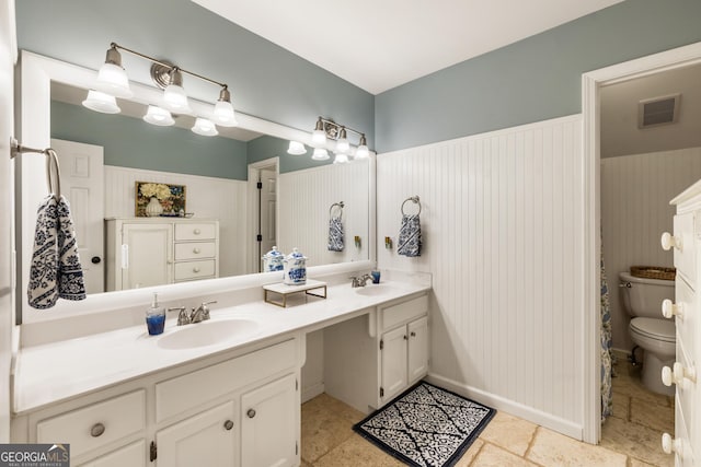10530 Tuxford Dr, Alpharetta, GA 30022 - bathroom with double vanity and toilet
