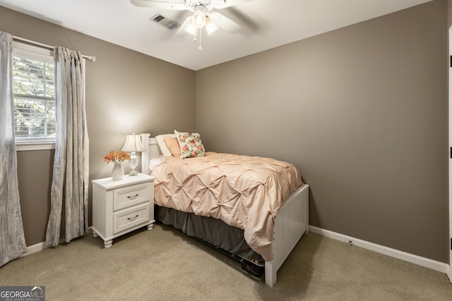 10530 Tuxford Dr, Alpharetta, GA 30022 - bedroom featuring light colored carpet and ceiling fan
