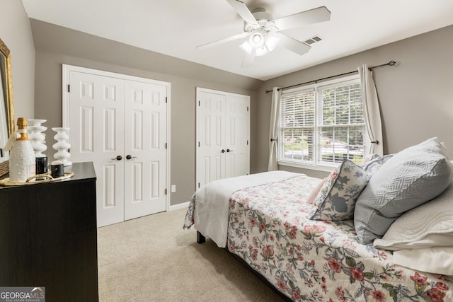 10530 Tuxford Dr, Alpharetta, GA 30022 - carpeted bedroom with multiple closets and ceiling fan