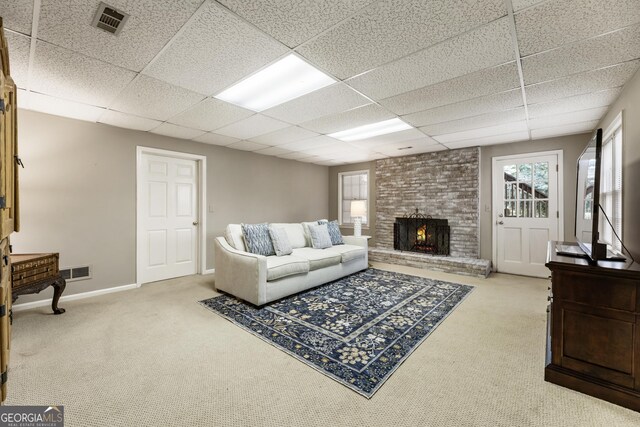 10530 Tuxford Dr, Alpharetta, GA 30022 - carpeted living room with a paneled ceiling and a brick fireplace