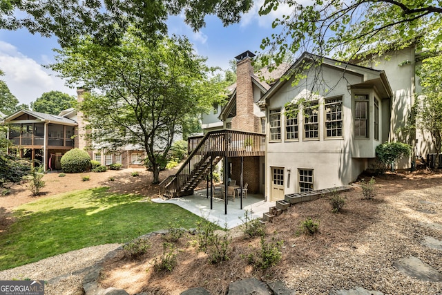 10530 Tuxford Dr, Alpharetta, GA 30022 - back of property with stairs, a patio, a deck, and stucco siding