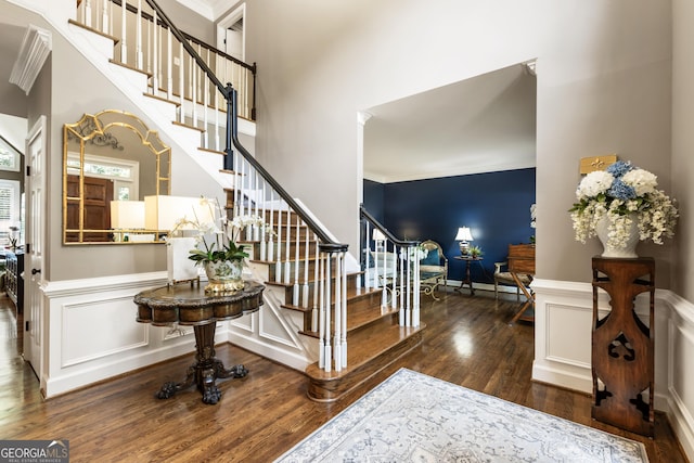 10530 Tuxford Dr, Alpharetta, GA 30022 - entrance foyer with wood finished floors, stairs, ornamental molding, a wainscoted wall, and a decorative wall