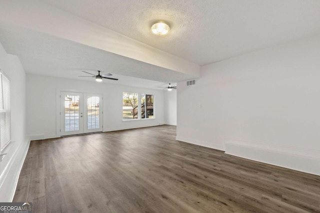 2139 Logan Dr, Jonesboro, GA 30236 - unfurnished living room featuring a ceiling fan, wood finished floors, a textured ceiling, and french doors