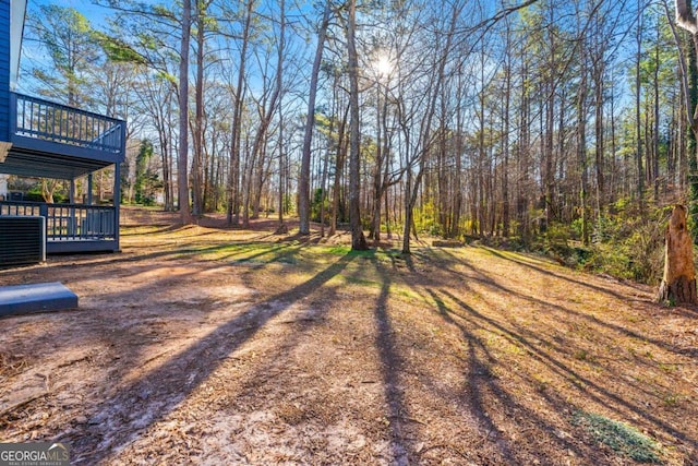2139 Logan Dr, Jonesboro, GA 30236 - view of yard featuring a deck and cooling unit