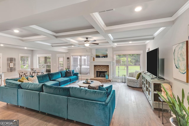 29 Peppertree Dr, Newnan, GA 30265 - living area with coffered ceiling, ceiling fan, beamed ceiling, wood finished floors, and a fireplace