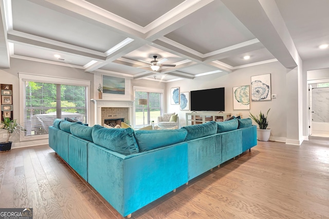 29 Peppertree Dr, Newnan, GA 30265 - living room featuring ceiling fan, wood finished floors, a fireplace, beamed ceiling, and coffered ceiling