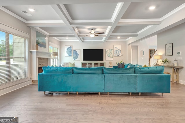 29 Peppertree Dr, Newnan, GA 30265 - living room featuring a ceiling fan, wood finished floors, beamed ceiling, a fireplace, and coffered ceiling