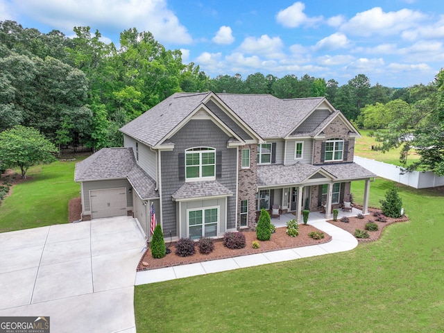 29 Peppertree Dr, Newnan, GA 30265 - craftsman house featuring a porch, concrete driveway, an attached garage, and roof with shingles