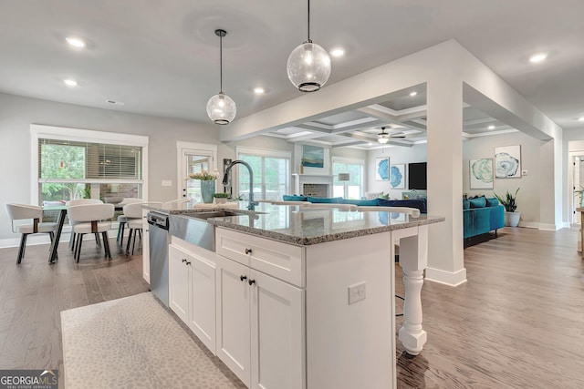 29 Peppertree Dr, Newnan, GA 30265 - kitchen featuring dishwasher, ceiling fan, recessed lighting, light wood-style flooring, and light stone countertops