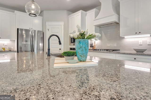 29 Peppertree Dr, Newnan, GA 30265 - kitchen with stainless steel appliances, custom exhaust hood, and white cabinetry