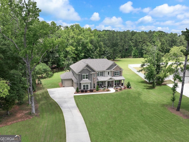 29 Peppertree Dr, Newnan, GA 30265 - view of front of house featuring covered porch, concrete driveway, a front lawn, a garage, and roof with shingles