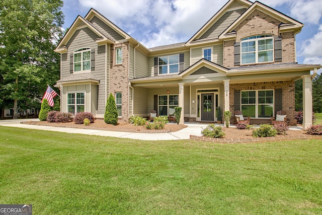 29 Peppertree Dr, Newnan, GA 30265 - craftsman-style house featuring brick siding, a front lawn, and covered porch