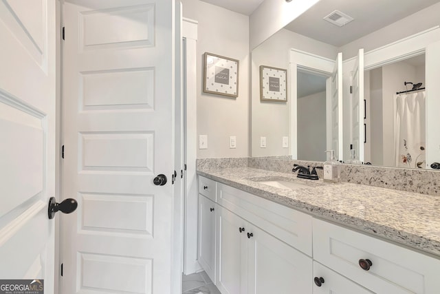 29 Peppertree Dr, Newnan, GA 30265 - bathroom with vanity and marble look tiles