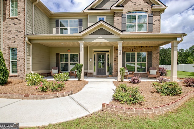29 Peppertree Dr, Newnan, GA 30265 - view of exterior entry with brick siding and covered porch