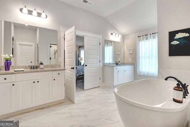29 Peppertree Dr, Newnan, GA 30265 - full bathroom featuring marble look tiles, vaulted ceiling, a soaking tub, two vanities, and walk in shower