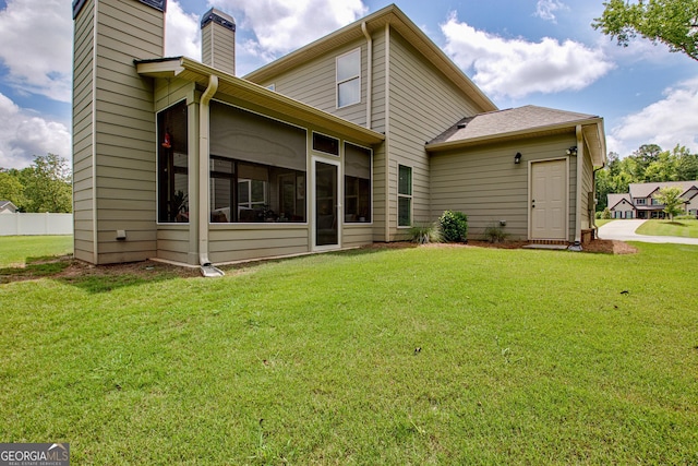 29 Peppertree Dr, Newnan, GA 30265 - back of property with a chimney and a sunroom