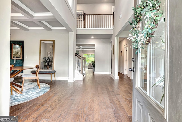 29 Peppertree Dr, Newnan, GA 30265 - entrance foyer featuring stairway, wood finished floors, and beam ceiling
