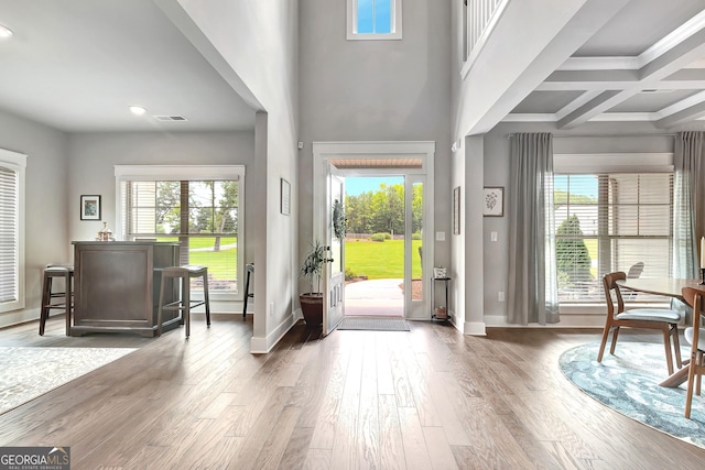 29 Peppertree Dr, Newnan, GA 30265 - entryway with healthy amount of natural light, wood finished floors, recessed lighting, beamed ceiling, and a towering ceiling