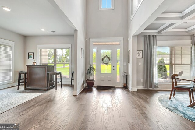 29 Peppertree Dr, Newnan, GA 30265 - entryway featuring plenty of natural light, wood finished floors, recessed lighting, a towering ceiling, and beam ceiling