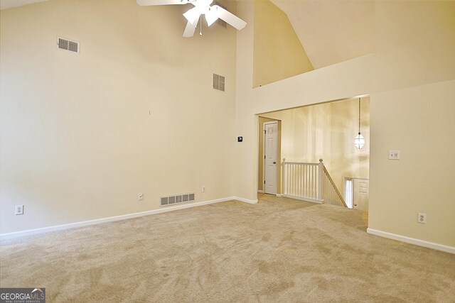 4135 Coursey Lake Rd, Douglasville, GA 30135 - empty room with light colored carpet, a ceiling fan, and high vaulted ceiling