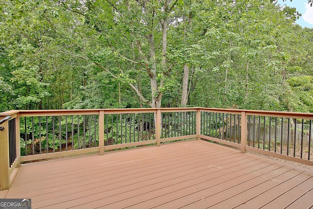 4135 Coursey Lake Rd, Douglasville, GA 30135 - wooden terrace featuring a view of trees