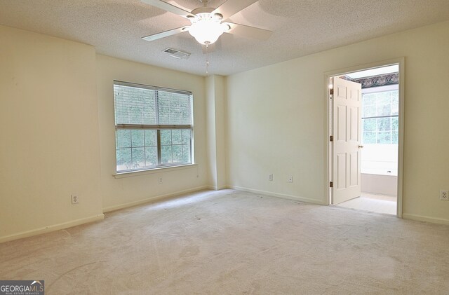 4135 Coursey Lake Rd, Douglasville, GA 30135 - carpeted spare room with ceiling fan and a textured ceiling