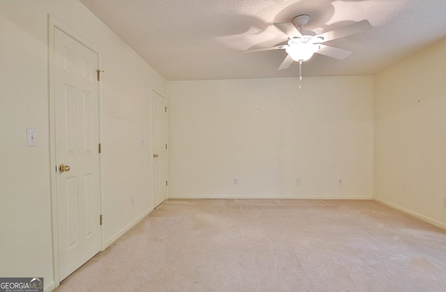 4135 Coursey Lake Rd, Douglasville, GA 30135 - unfurnished room with light colored carpet, ceiling fan, and a textured ceiling