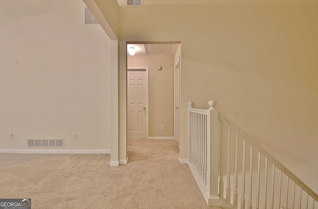 4135 Coursey Lake Rd, Douglasville, GA 30135 - hallway with light colored carpet and attic access