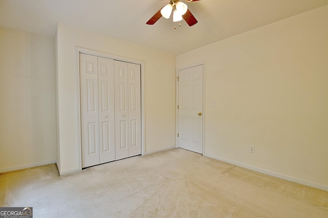 4135 Coursey Lake Rd, Douglasville, GA 30135 - unfurnished bedroom with light colored carpet, a closet, and a ceiling fan