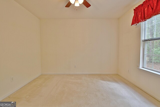4135 Coursey Lake Rd, Douglasville, GA 30135 - empty room with ceiling fan and light colored carpet