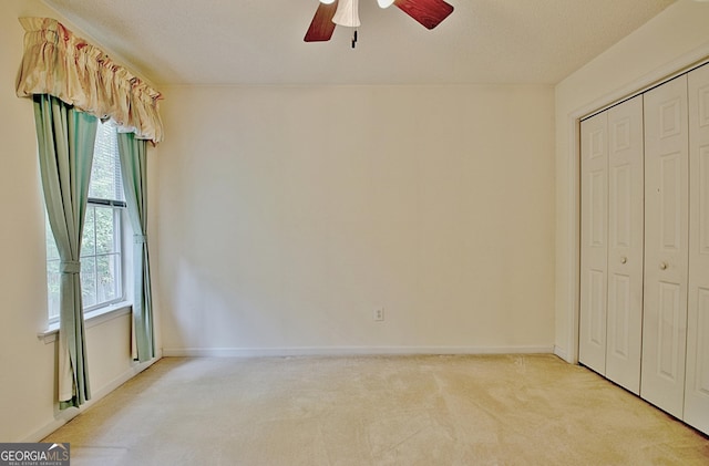 4135 Coursey Lake Rd, Douglasville, GA 30135 - unfurnished bedroom featuring carpet, a closet, and ceiling fan