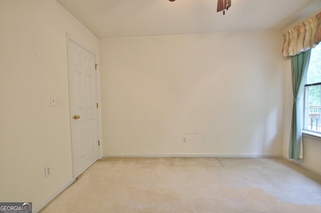 4135 Coursey Lake Rd, Douglasville, GA 30135 - empty room featuring ceiling fan and light carpet