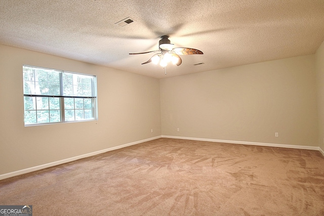4135 Coursey Lake Rd, Douglasville, GA 30135 - empty room with carpet, a ceiling fan, and a textured ceiling