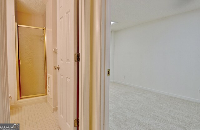 4135 Coursey Lake Rd, Douglasville, GA 30135 - corridor with a textured ceiling and carpet flooring