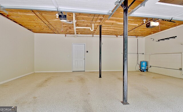 4135 Coursey Lake Rd, Douglasville, GA 30135 - garage featuring a garage door opener and baseboards