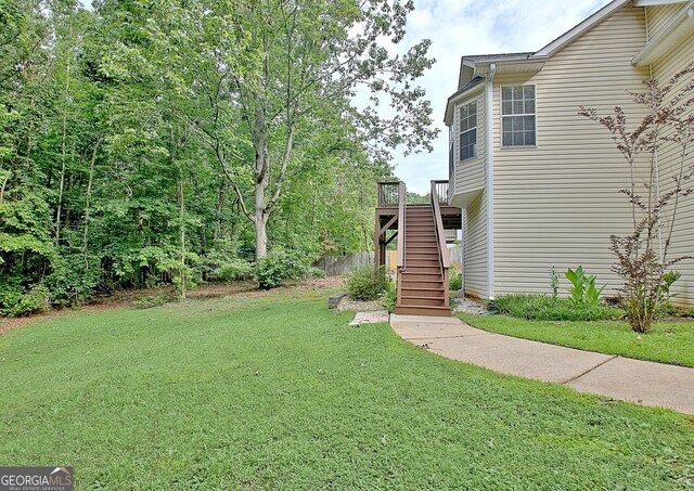 4135 Coursey Lake Rd, Douglasville, GA 30135 - view of green lawn with stairway and a wooden deck
